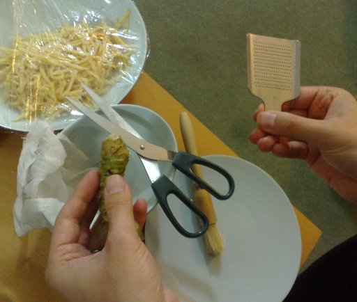 Wasabi being grated Wasabi being grated