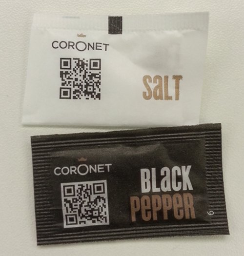 A tiny packet of salt which has a QR code printed on it.