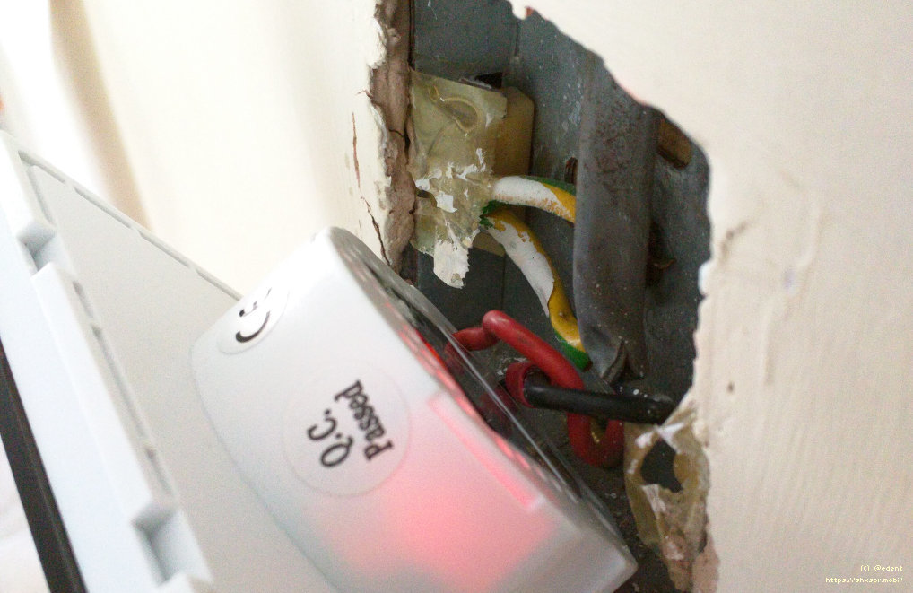 A light switch being installed into a wall