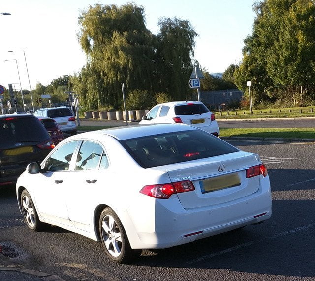 Car with numberplate blurred out.