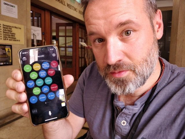 documentally holding a phone.
