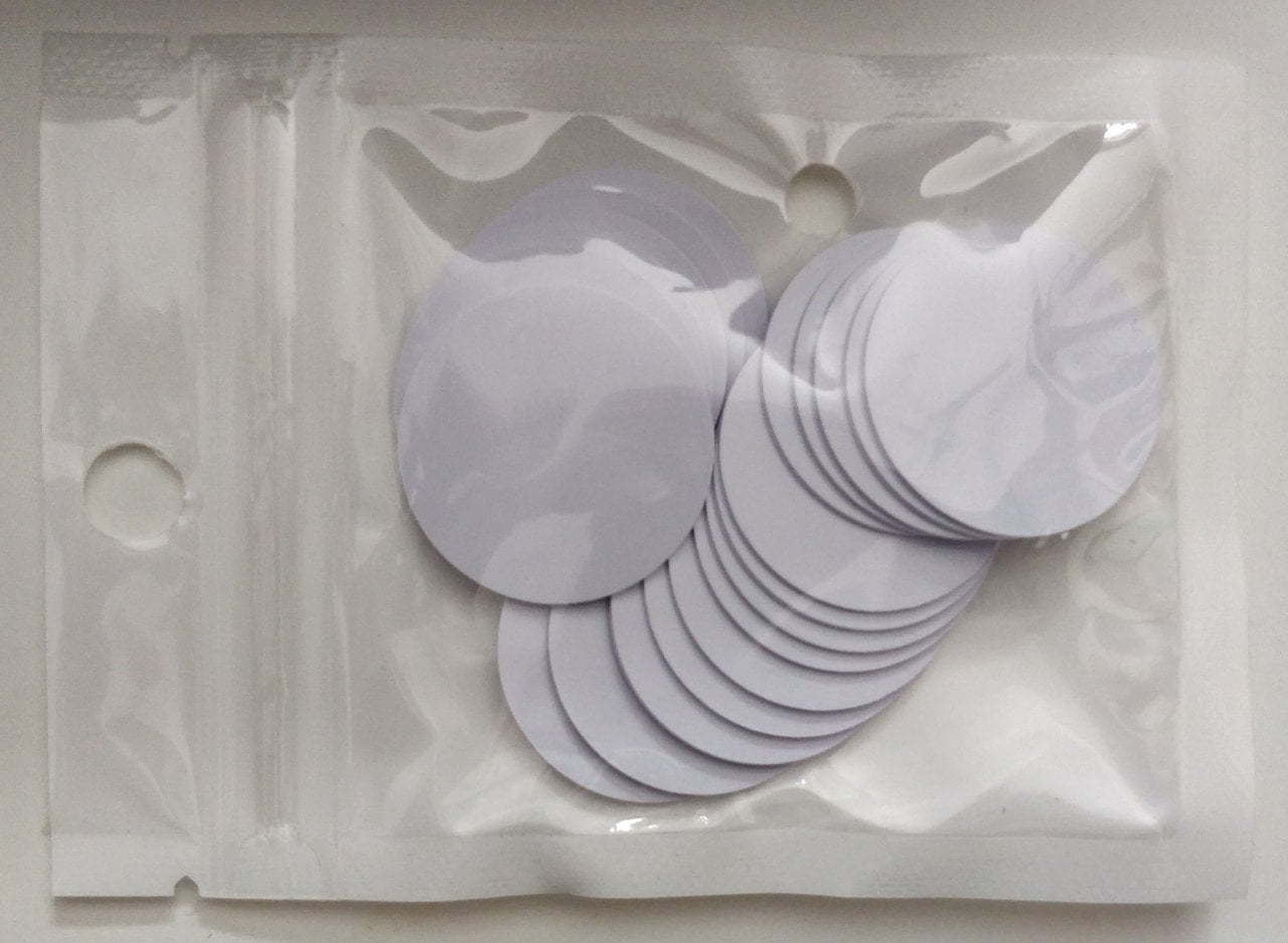 A bunch of white plastic circles in a bag.