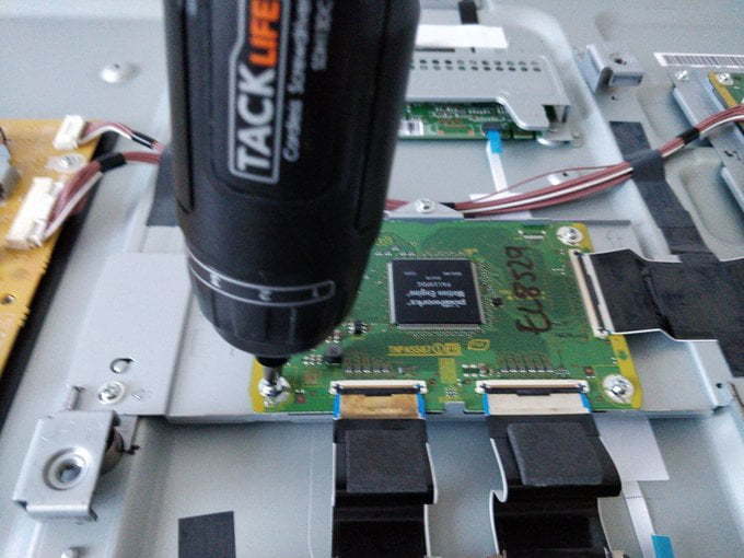Electric screwdriver reconnecting everything.
