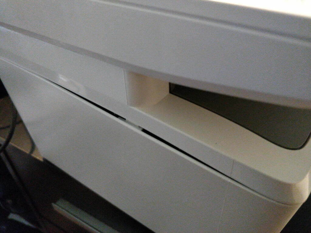 A plastic panel which has popped out.