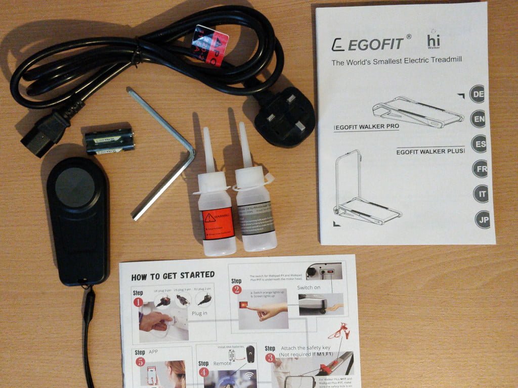 Photo of a manual, electrical lead, and other accessories.